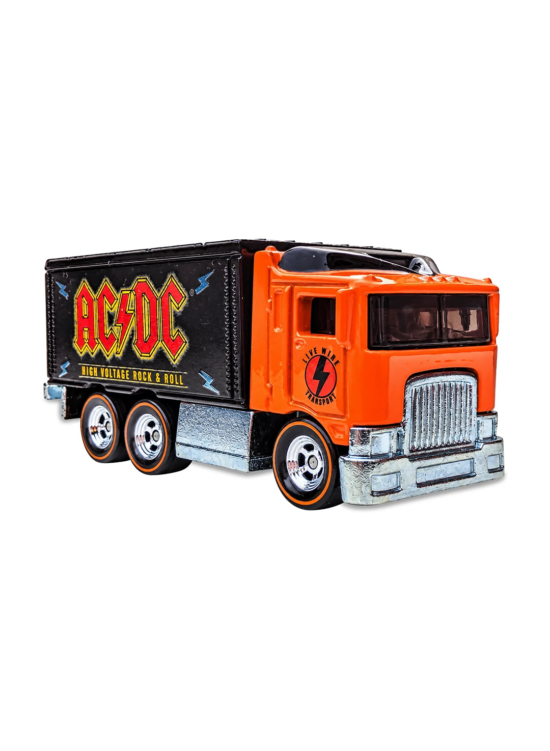 Close-up view of the orange and black Hot Wheels 2013 AC/DC Hiway Hauler truck showing side band graphics and orange-line Real Riders wheels.