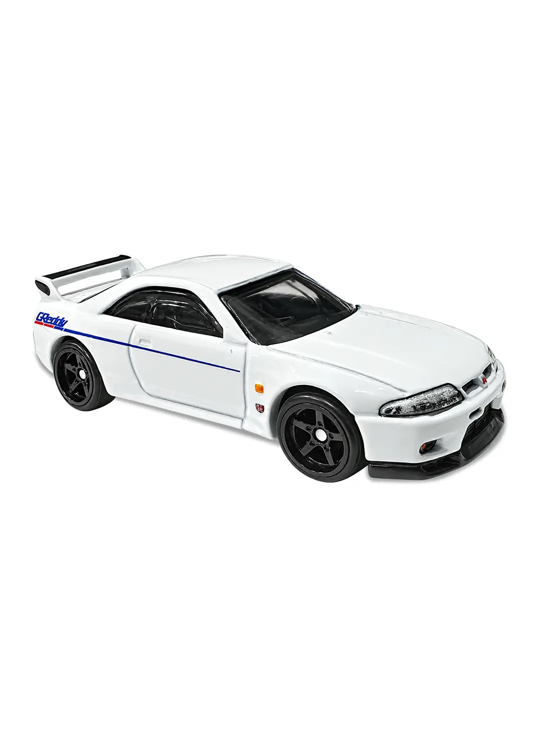 Close-up profile view of the premium midnight purple Hot Wheels Nissan Skyline GT-R R33 displaying its aggressive factory rear wing, sculpted sport coupe proportions, sharp trim contours, and dark matching RR6SPM Real Riders wheels.