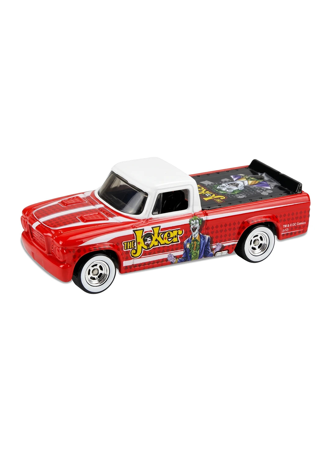 Close-up view of the red and white Hot Wheels The Joker '63 Studebaker Champ truck showing side character graphics and white-wall Real Riders wheels.