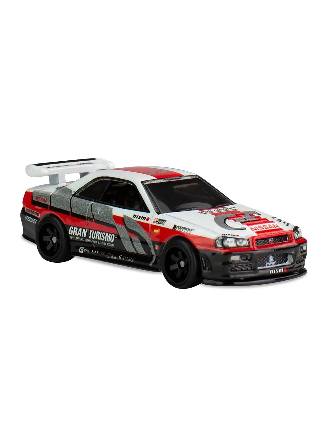 Close-up view of the white and red Hot Wheels Gran Turismo Nissan Skyline GT-R (BNR34) showing side sponsor decals and matching black six-spoke Real Riders wheels.