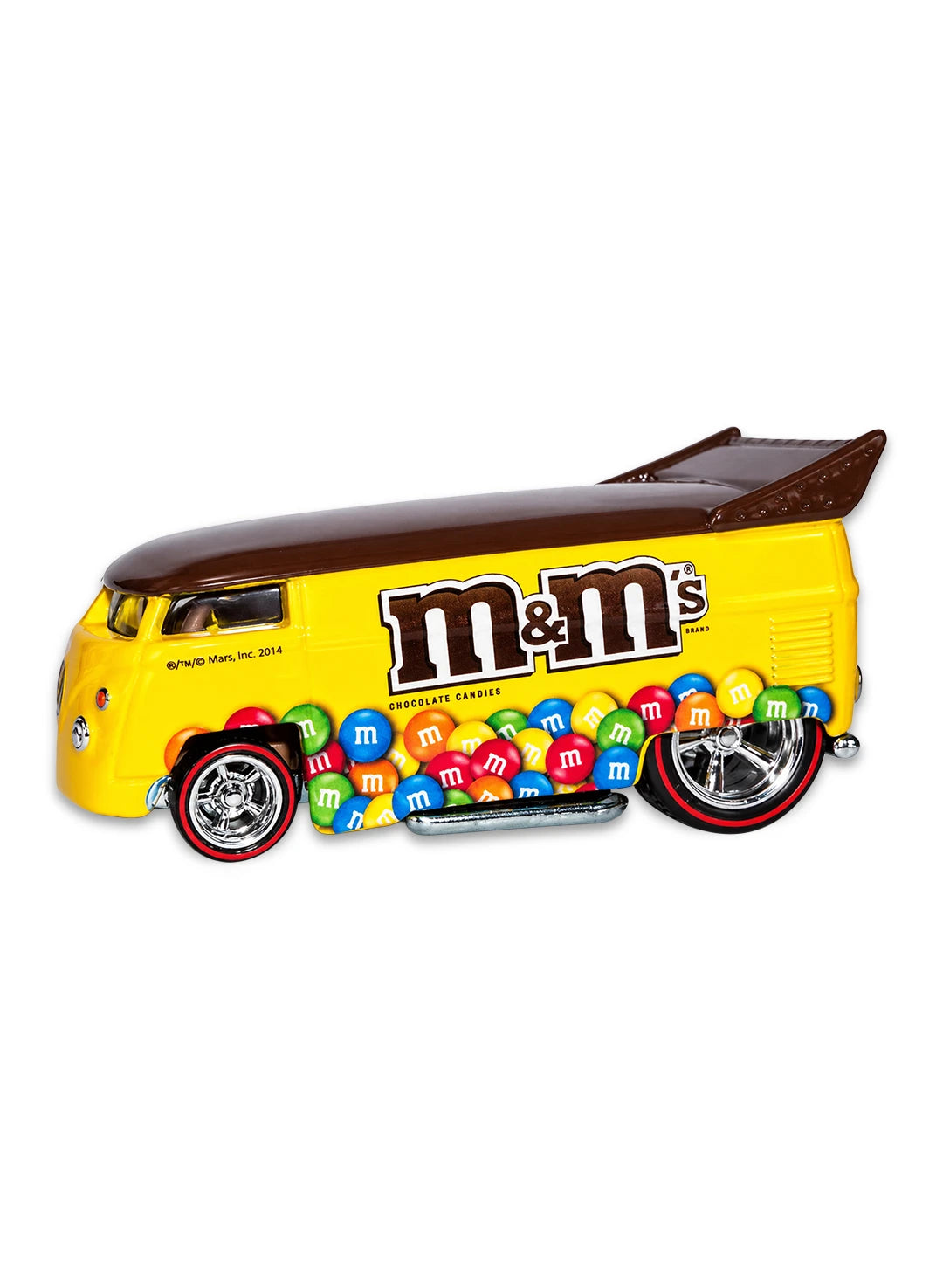 Close-up view of the yellow Hot Wheels M&M's Volkswagen Drag Bus showing a chocolate brown roof, side logos, and chrome Real Riders wheels.