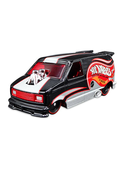 Close-up view of the gloss black Hot Wheels 1985 Chevy Astro Van showing side flame graphics and redline Real Riders wheels.