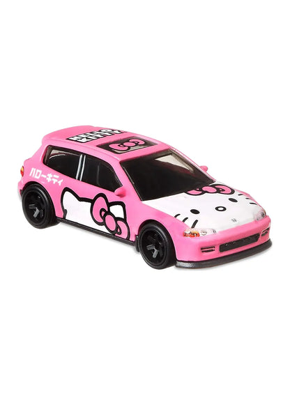 Close-up view of the premium hot pink Hot Wheels Honda Civic EG showing detailed Hello Kitty hood graphics, accurate door decals, tuner street aero styling, and black multi-spoke RR6SPM Real Riders wheels.