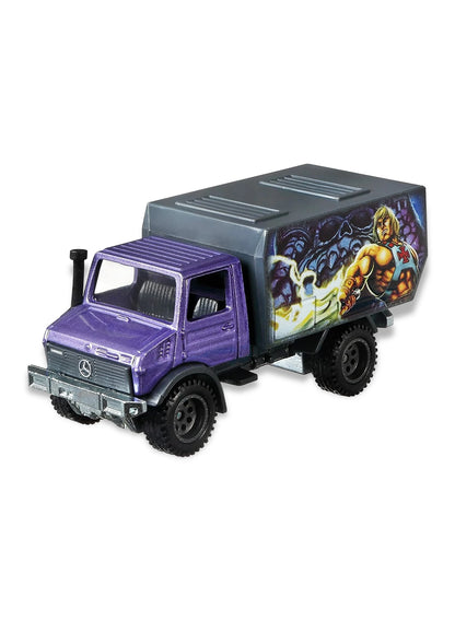 Close-up view of the metallic purple Hot Wheels He-Man Mercedes-Benz Unimog truck showing side cargo bed graphics and black off-road wheels.