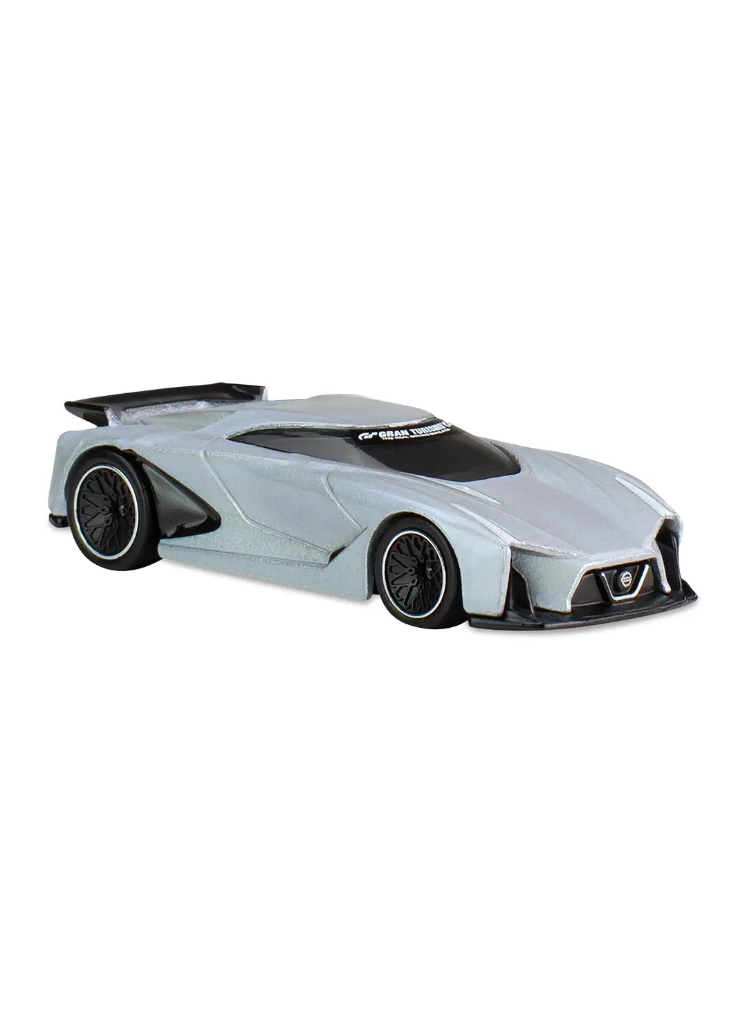 Close-up view of the metallic silver Hot Wheels Nissan Concept 2020 Vision Gran Turismo supercar showing a large carbon fiber style rear wing and black split-spoke Real Riders wheels.