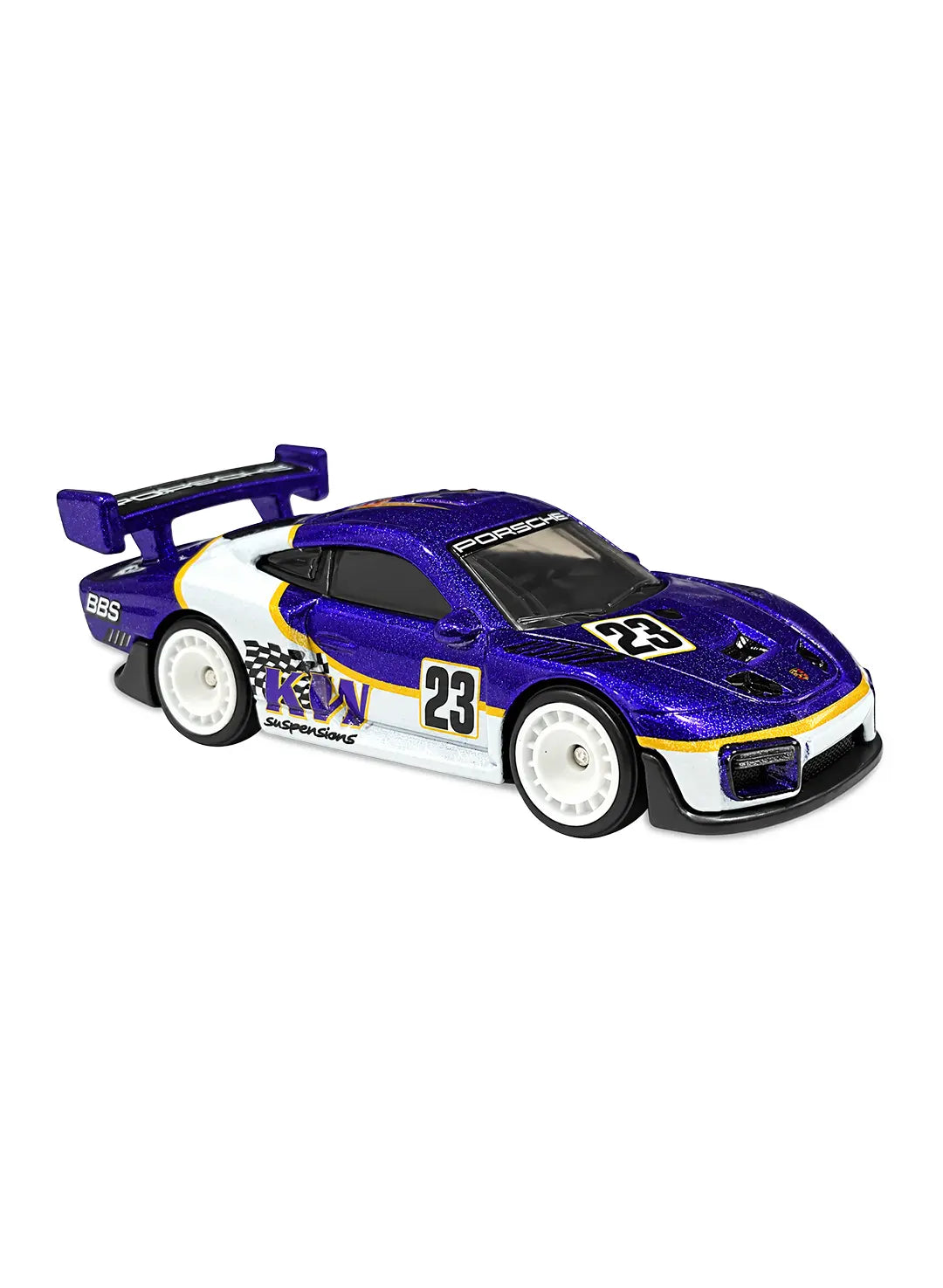 Close-up side view of the premium white Hot Wheels Porsche 935 showing detailed racing decals, crisp sponsor graphics, aerodynamic racing body kit profiles, and matching black Real Riders wheels with deep dish hubs.