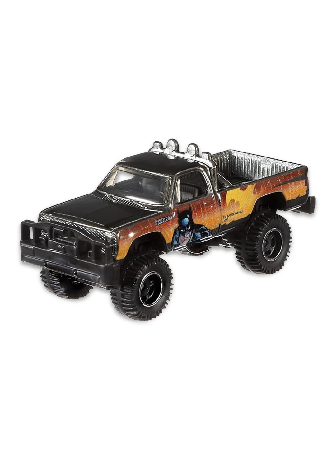 Close-up view of the raw ZAMAC Hot Wheels Batman '80 Dodge Macho Power Wagon truck showing side flame graphics and off-road Real Riders wheels.