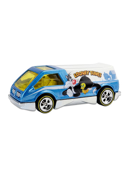 Close-up view of the white and metalflake blue Hot Wheels 2013 Looney Tunes Dream Van XGW showing the Sylvester and Tweety side graphic and yellow-line Real Riders tires.