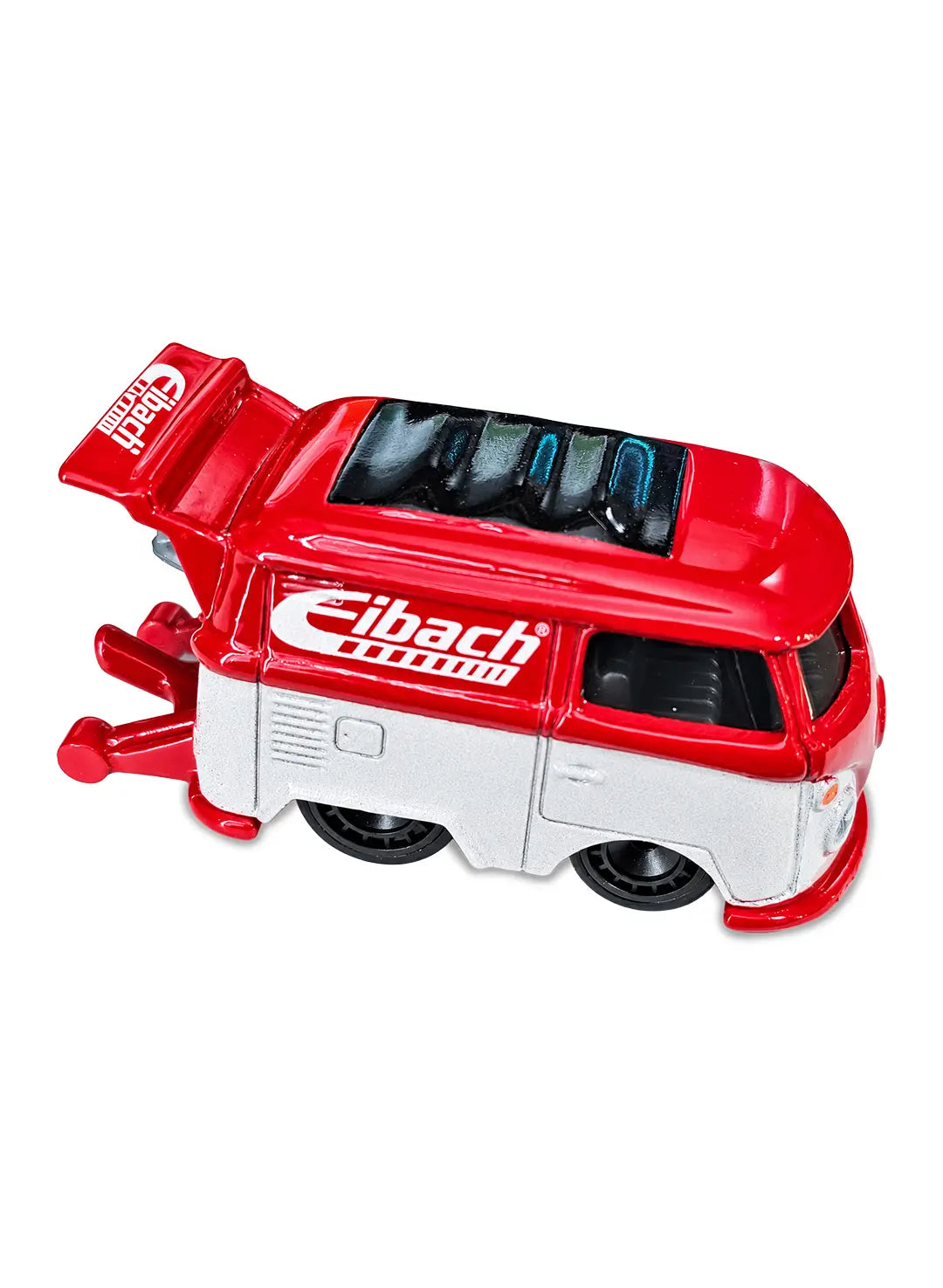 Close-up view of the two-tone red and cream Hot Wheels Eibach Kool Kombi microbus showing side brand graphics and classic black Real Riders wheels.