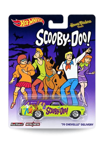 Close-up view of the white Hot Wheels Tom and Jerry Cool-One truck showing side chase graphics and red-rimmed Real Riders wheels.