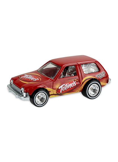 Close-up view of the metalflake red Hot Wheels 2013 Totino's '77 Packin' Pacer showing side logos and white-wall Real Riders wheels.