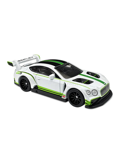 Close-up view of the white Hot Wheels 2018 Bentley Continental GT3 showing bright green racing stripes, a Union Jack flag side decal, a massive white spoiler, and black Real Riders wheels.