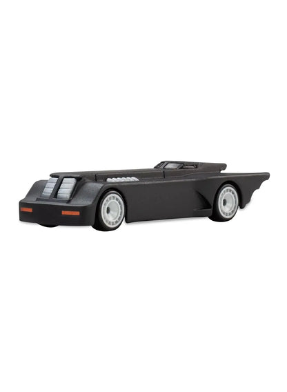 Close-up view of the matte black Hot Wheels Batman The Animated Series Batmobile showing an elongated geometric body shape, exhaust port details, and silver disc Real Riders wheels.