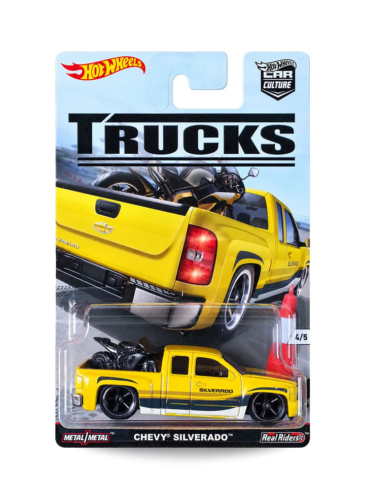 Hot Wheels Car Culture Trucks Chevy Silverado 1:64 scale premium diecast pickup truck mint on its original 4/5 numbered city street blister card displaying a yellow truck carrying a motorcycle.