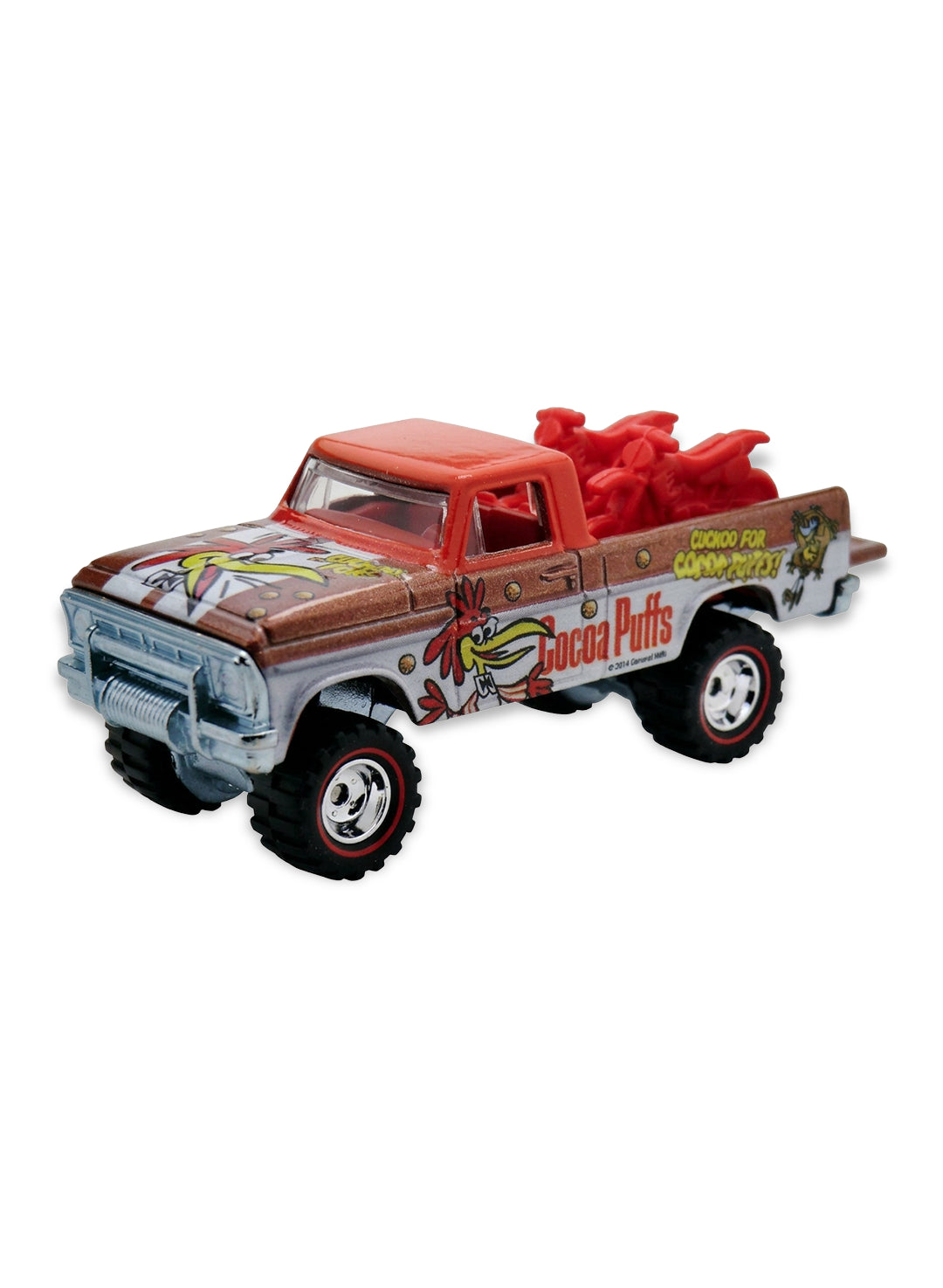 Close-up view of the white and brown Hot Wheels Cocoa Puffs Texas Drive 'Em truck showing side mascot graphics and deep-dish chrome Real Riders wheels.