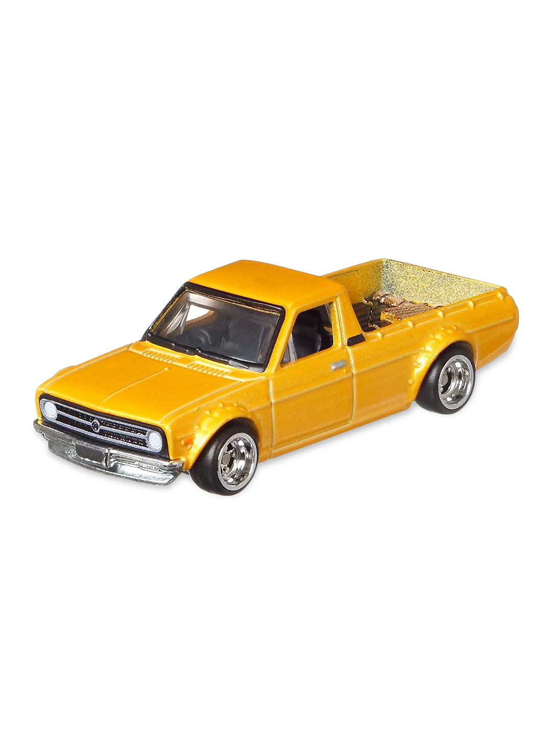 Close-up view of the metallic gold Hot Wheels '75 Datsun Sunny Truck (B120) showing detailed art supply cargo in the pickup bed and silver-rimmed Real Riders wheels with white-lettered tires.