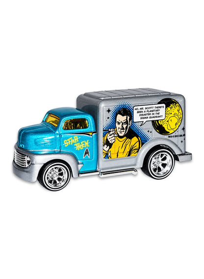 Close-up view of the silver and blue Hot Wheels Star Trek '49 Ford C.O.E. truck showing side Captain Kirk graphics and chrome Real Riders wheels.