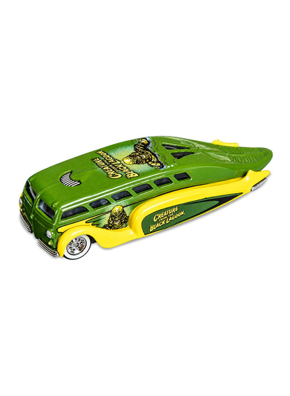 Close-up view of the metallic green and yellow Hot Wheels 2013 Universal Monsters Creature from the Black Lagoon Low Flow showing side character graphics and chrome Real Riders wheels.