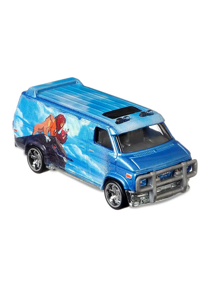 Close-up view of the sky blue Hot Wheels The Lion King Custom GMC Panel Van showing side sunset graphics and chrome wheels.