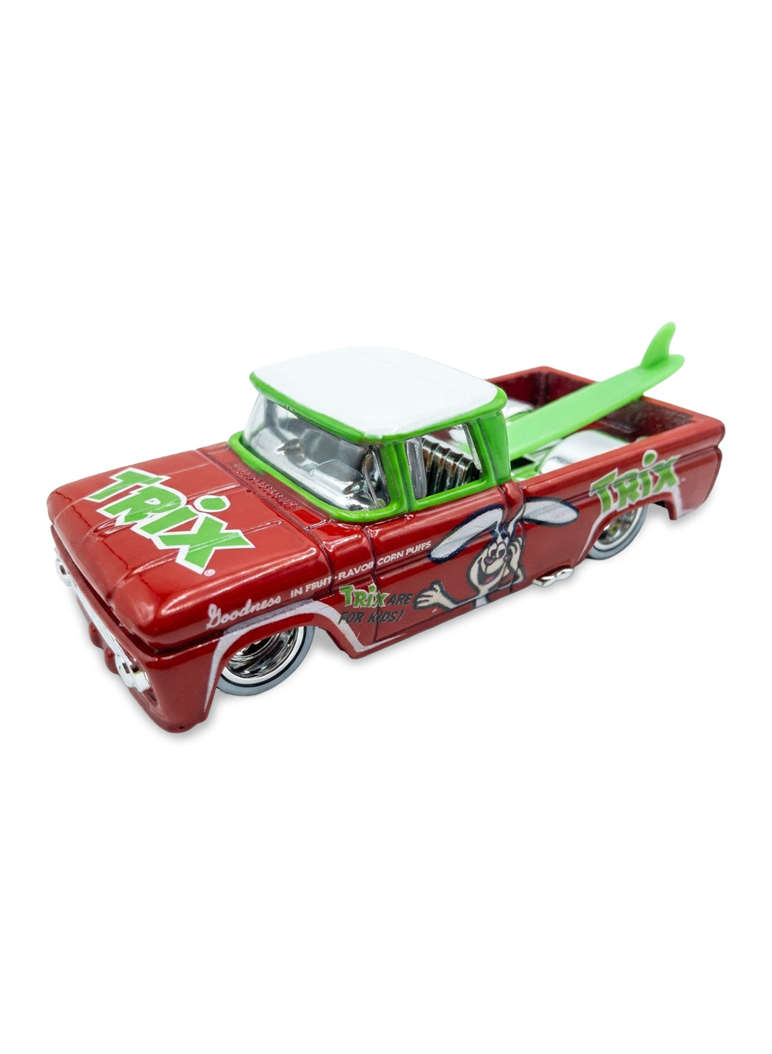 Close-up view of the candy red and green Hot Wheels Trix Custom '62 Chevy truck showing side rabbit graphics and chrome Real Riders wheels.
