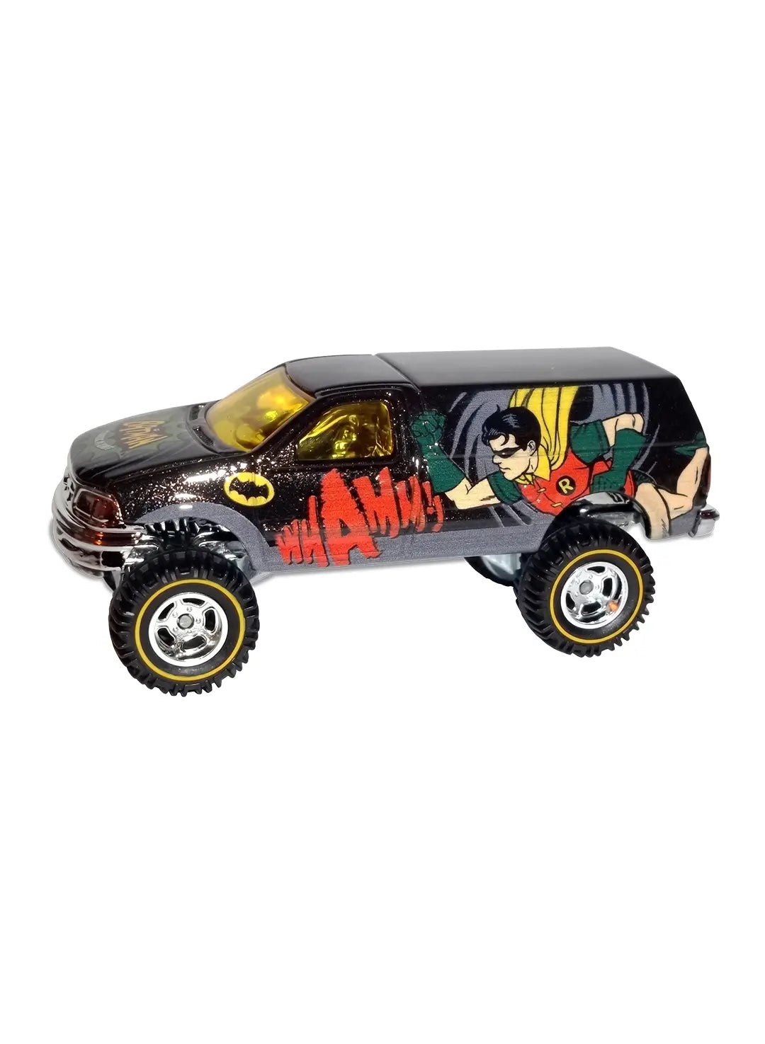 Close-up view of the metallic dark grey Hot Wheels Robin Ford F-150 truck showing side comic action graphics and chrome Real Riders wheels.