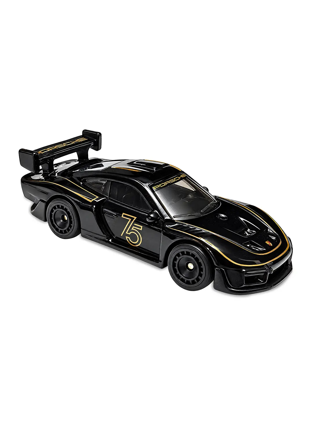 Close-up view of the rare limited-edition matte black Hot Wheels Porsche 935 Chase car showing its aggressive aerodynamic silhouette, large rear wing, detailed track-focused body contours, and matching dark premium RRA Real Riders wheels.