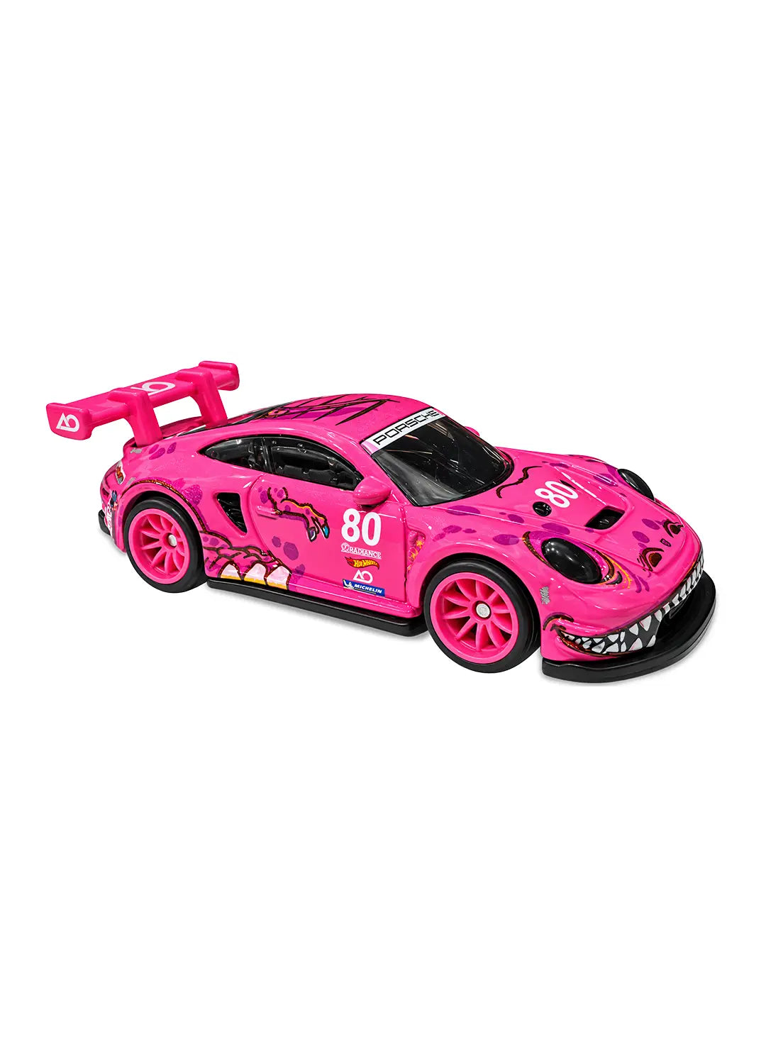 Close-up view of the rare limited-edition hot pink Hot Wheels "Roxy" Porsche 911 GT3 R showing a detailed dinosaur mouth grill decal, racing number 80 graphics, and matching hot pink Real Riders wheels.