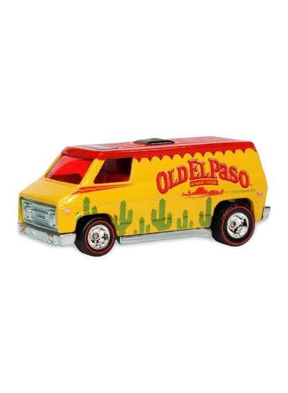 Close-up view of the yellow Hot Wheels 2013 Old El Paso Super Van showing side cactus graphics and chrome Real Riders wheels.