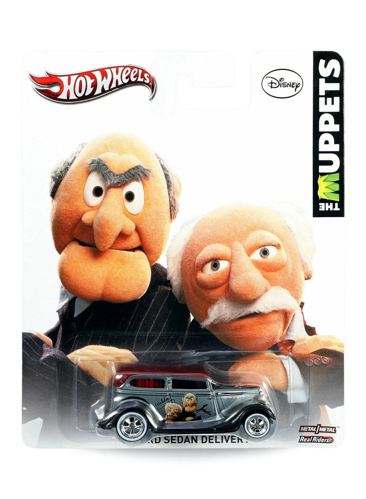 Hot Wheels Pop Culture 2014 The Muppets '34 Ford Sedan Delivery 1:64 scale diecast car mint on its original Disney Statler and Waldorf blister card.