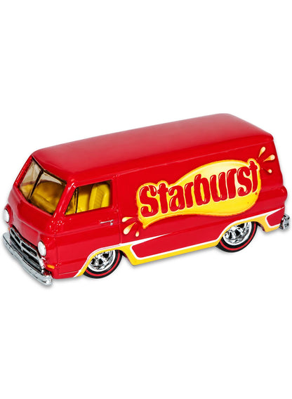 Close-up view of the metallic red Hot Wheels Starburst '66 Dodge A100 van showing a yellow base trim, side logos, and red-rimmed Real Riders wheels.