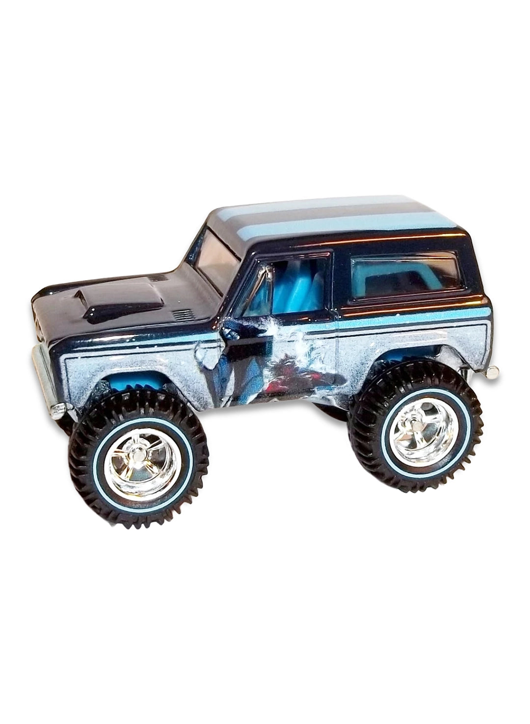 Close-up view of the metallic dark grey Hot Wheels Star Wars '67 Ford Bronco truck showing side throne room graphics and chrome Real Riders wheels.