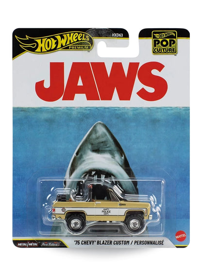 Hot Wheels Premium Pop Culture JAWS '75 Chevy Blazer Custom 1:64 scale premium diecast truck mint on its original movie poster themed blister card featuring the iconic great white shark artwork.