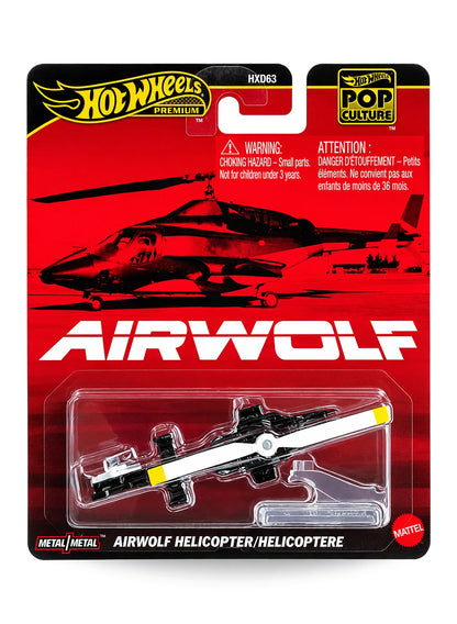 Hot Wheels Premium Pop Culture Airwolf Helicopter premium diecast vehicle mint on its original retro action television show themed red card displaying a silhouette photo of the high-tech chopper.