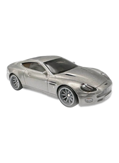Close-up view of the sleek metallic silver Hot Wheels James Bond Aston Martin Vanquish coupe showing a detailed front grille, side fender vents, and grey split-spoke Real Riders wheels.