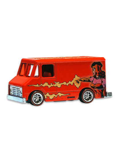 Close-up view of the red Hot Wheels Scarlet Witch Combat Medic van showing side comic panel graphics and chrome Real Riders wheels.