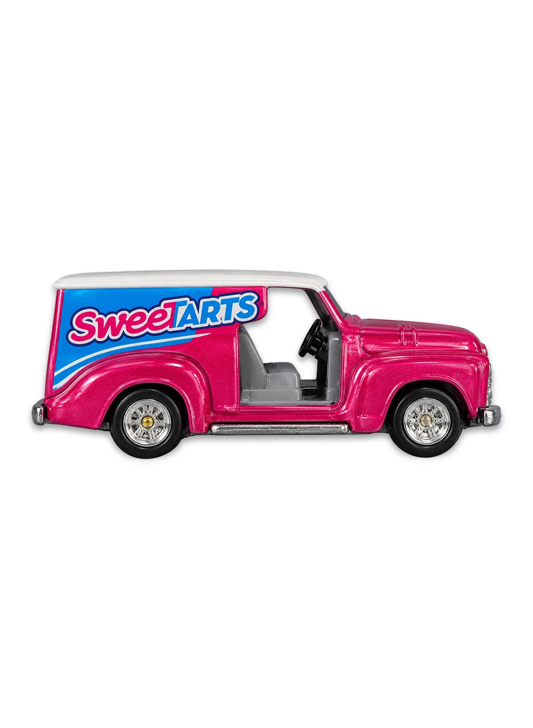 Close-up view of the metallic pink Hot Wheels SweeTARTS Custom '52 Chevy truck showing its white roof, side graphics, and chrome Real Riders wheels.