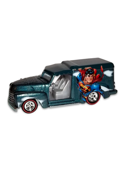 Close-up view of the metallic teal blue Hot Wheels Superman Custom '52 Chevy van showing side comic graphics and redline Real Riders wheels.