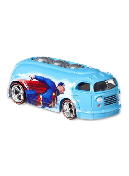 Close-up view of the metallic blue Hot Wheels Superman Haulin' Gas truck showing side flying graphics and chrome Real Riders wheels.