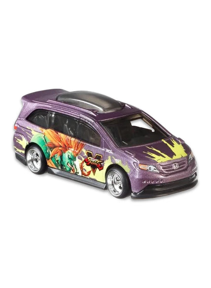 Close-up view of the metallic purple Hot Wheels Blanka Honda Odyssey minivan showing side jungle shock graphics and chrome wheels.