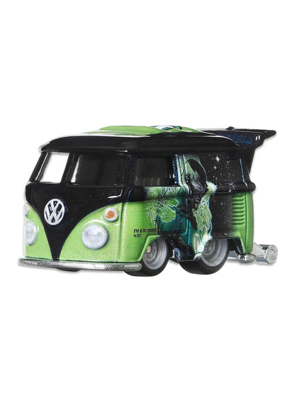 Close-up view of the two-tone black and green Hot Wheels Green Lantern Kool Kombi van showing side graphics and chrome wheels.