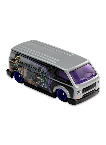 Close-up view of the dark grey Hot Wheels Batman MBK Van showing side comic panel graphics and purple wheels.