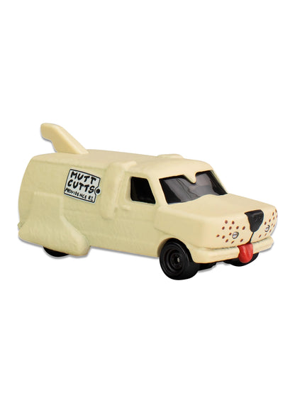 Close-up view of the tan Hot Wheels Mutt Cutts Van showing sculpted fur texture details, floppy ears, a rear tail spoiler, and black Real Riders wheels.