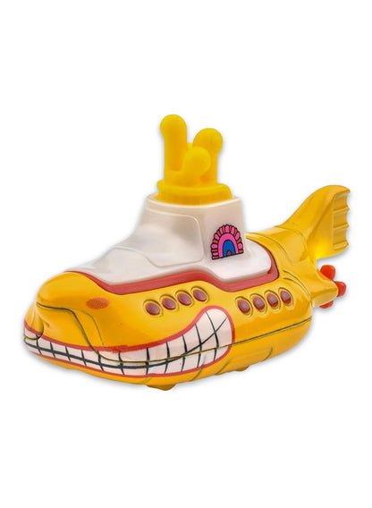 Close-up view of the yellow Hot Wheels The Beatles Yellow Submarine showing a white upper deck, red periscopes, painted circular port holes, and small black wheels.