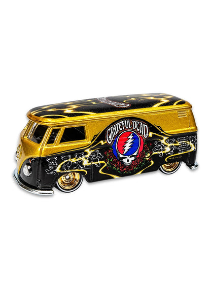 Close-up view of the metallic gold and black Hot Wheels Grateful Dead Volkswagen T1 Panel Bus showing side Stealie graphics and gold Real Riders wheels.