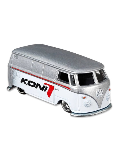Close-up view of the unpainted silver ZAMAC Hot Wheels KONI Volkswagen T1 Panel Bus showing red logos and chrome wheels.